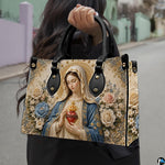 Model carrying Immaculate Heart of Mary devotional handbag outdoors
