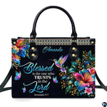 Christian rainbow hummingbird hibiscus handbag displayed alone on white background.