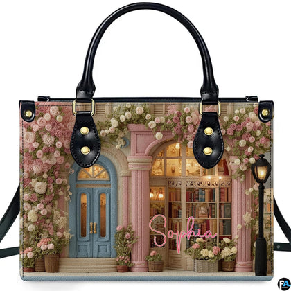 Front product view of embroidered rose bookshop handbag on white background.