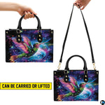 Handbag displayed in two carrying styles held by top handle and shoulder strap on white background.