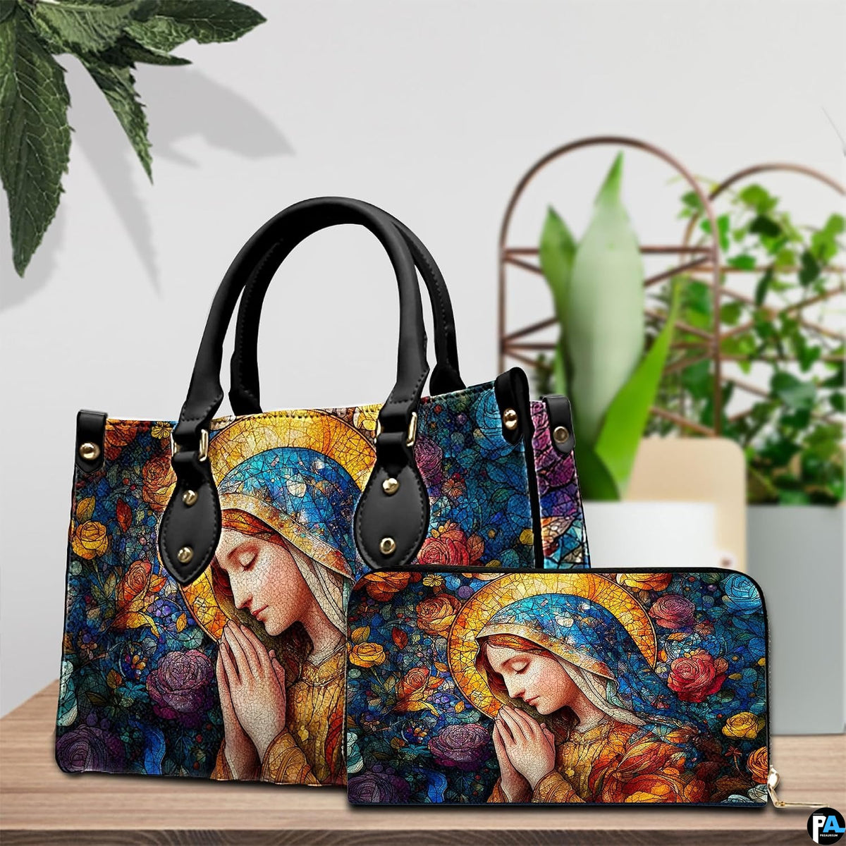 Stained glass rose Mary handbag and matching wallet shown with tabletop potted plant