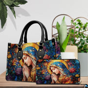 Stained glass rose Mary handbag and matching wallet shown with tabletop potted plant
