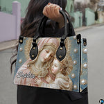 Model carrying pearl embroidered Madonna and Child devotional handbag outdoors