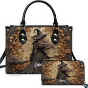 Gothic autumn witch broomstick handbag and matching wallet set displayed upright on white background.