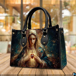 Handbag and matching wallet featuring Blessed Virgin Mary artwork on cafe tabletop.