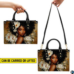 Demonstration displaying handheld lift and hanging options for the floral afro portrait item.