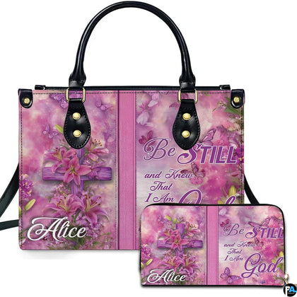 Pink lily cross handbag and matching zip wallet shown against studio background with floral artwork.