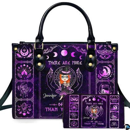 Purple gothic occult witch handbag displayed beside matching companion wallet.