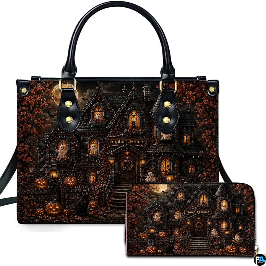Haunted house artwork accessory held outdoors showcasing illuminated gothic manor, smiling ghosts, and pumpkins.