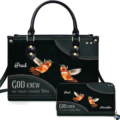 Front view of hummingbird couple handbag and matching zip wallet on solid white background
