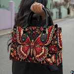 Lifestyle presentation of crimson butterfly handbag and wallet set with accessories