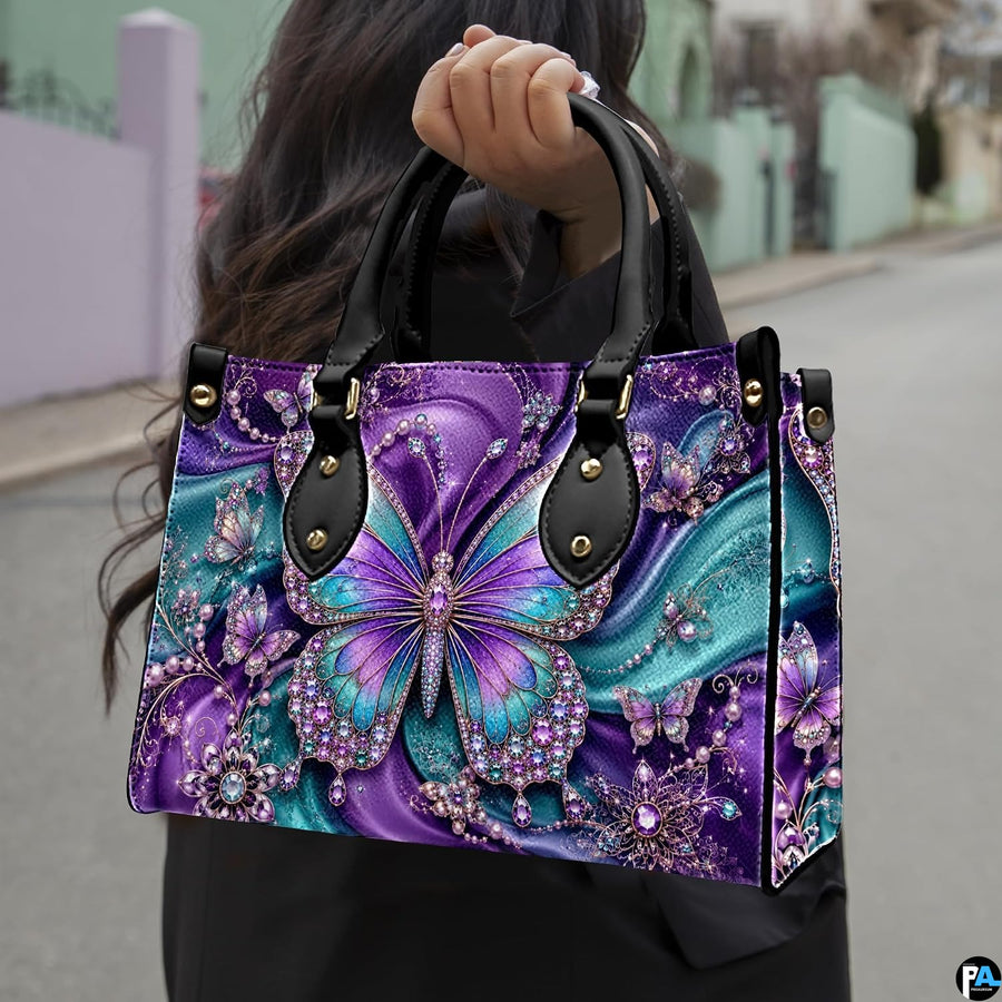 Outdoor street perspective showing purple and teal butterfly artwork held by pedestrian along town sidewalk.