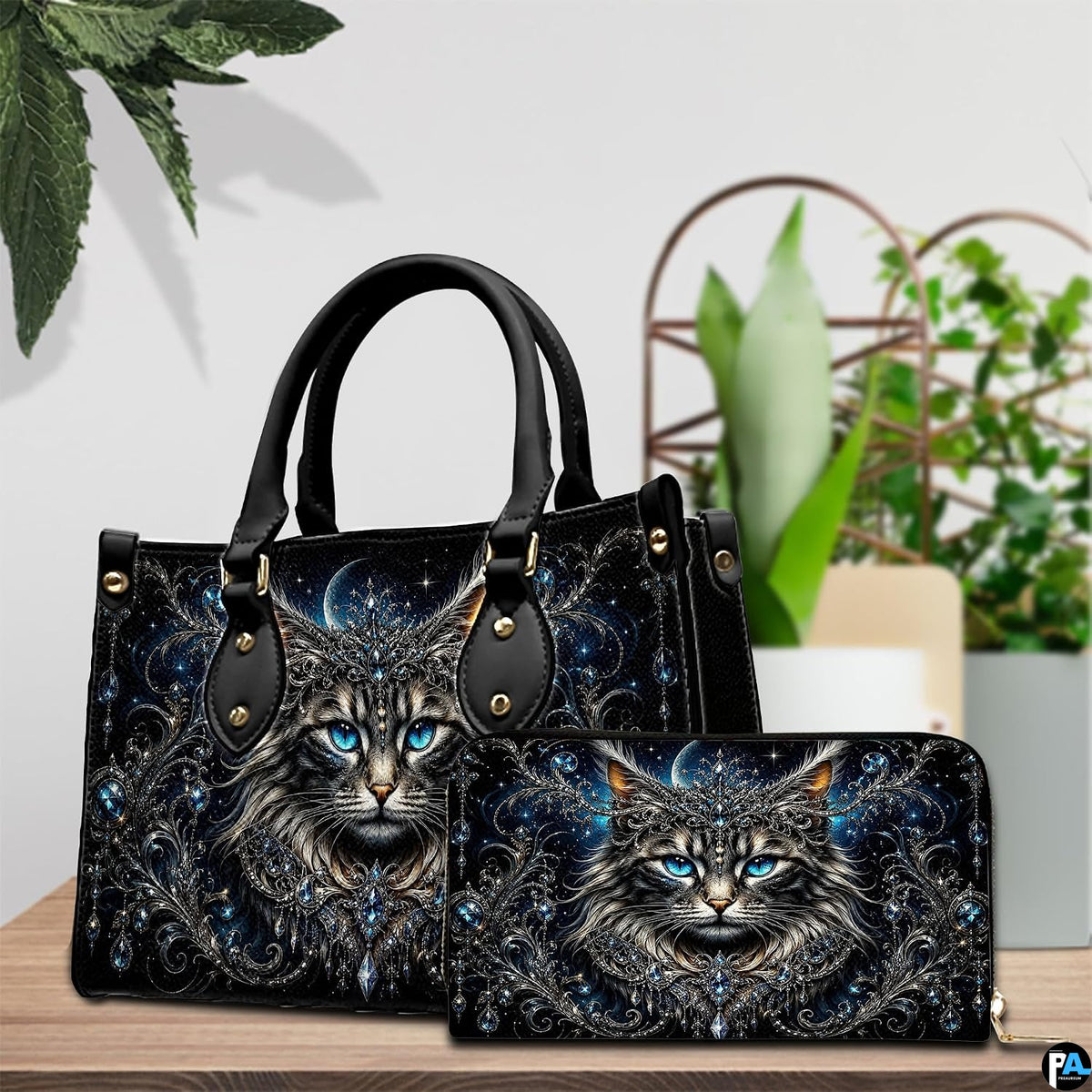 Indoor table view featuring crowned cat artwork and companion accessory beside houseplants.