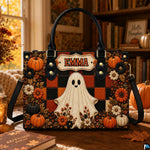 Autumn ghost satchel displayed indoors on a rustic wooden table surrounded by seasonal decor.