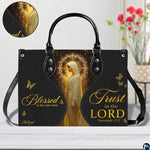 Front view of matching wallet displaying golden sacred figure, celestial halo, and butterfly accents.
