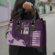 Angled showcase of purple floral faith purse paired with coordinating zippered wallet companion.
