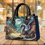 Perspective view of celestial dragon handbag resting on rustic wood surface.