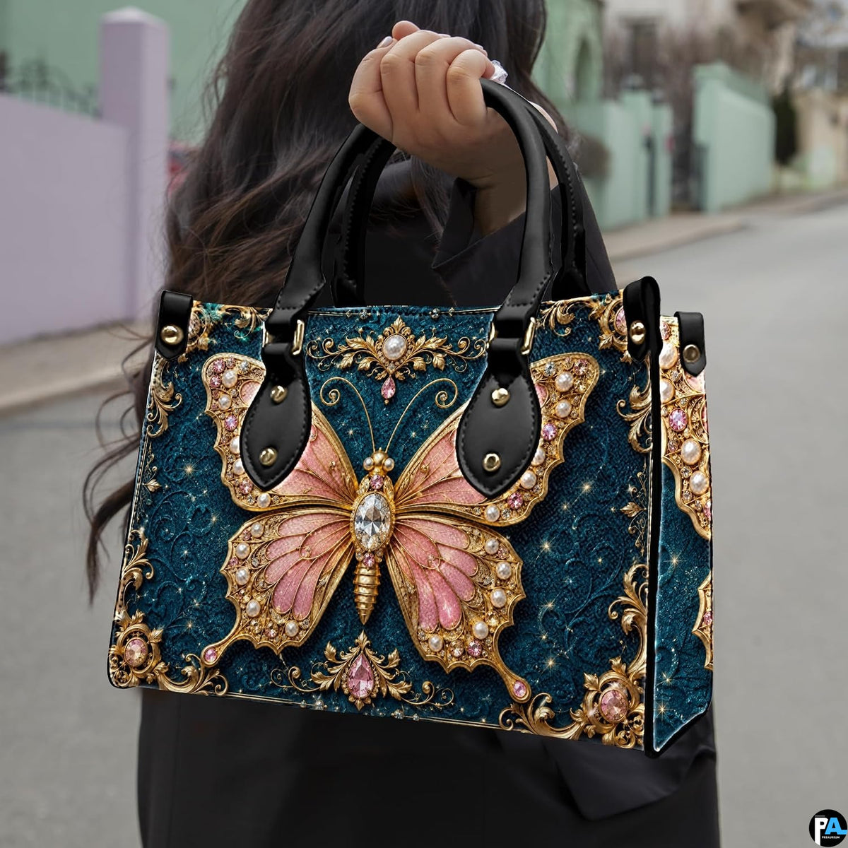 Outdoor street perspective showing baroque teal jewel butterfly artwork held by pedestrian along town sidewalk.