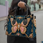 Outdoor street perspective showing baroque teal jewel butterfly artwork held by pedestrian along town sidewalk.