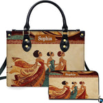 Handbag and matching zip wallet displayed together showcasing regal African queen figures in swirling gowns.