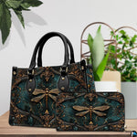 Side profile of gold dragonfly handbag showing continuous Victorian damask pattern along gusset