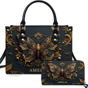 Front view of antique gold Baroque butterfly handbag and matching zip wallet on white backdrop