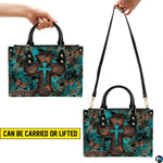 Matching zip wallet featuring layered turquoise cross and fluttering monarch butterflies.