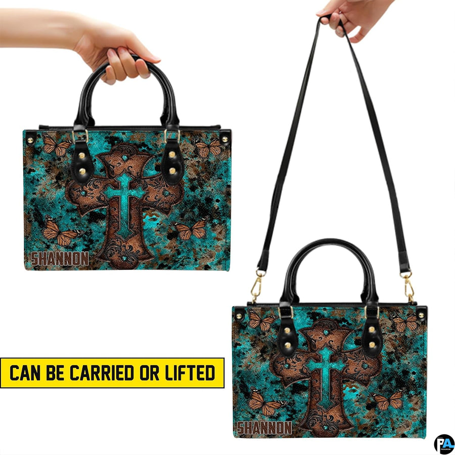 Matching zip wallet featuring layered turquoise cross and fluttering monarch butterflies.
