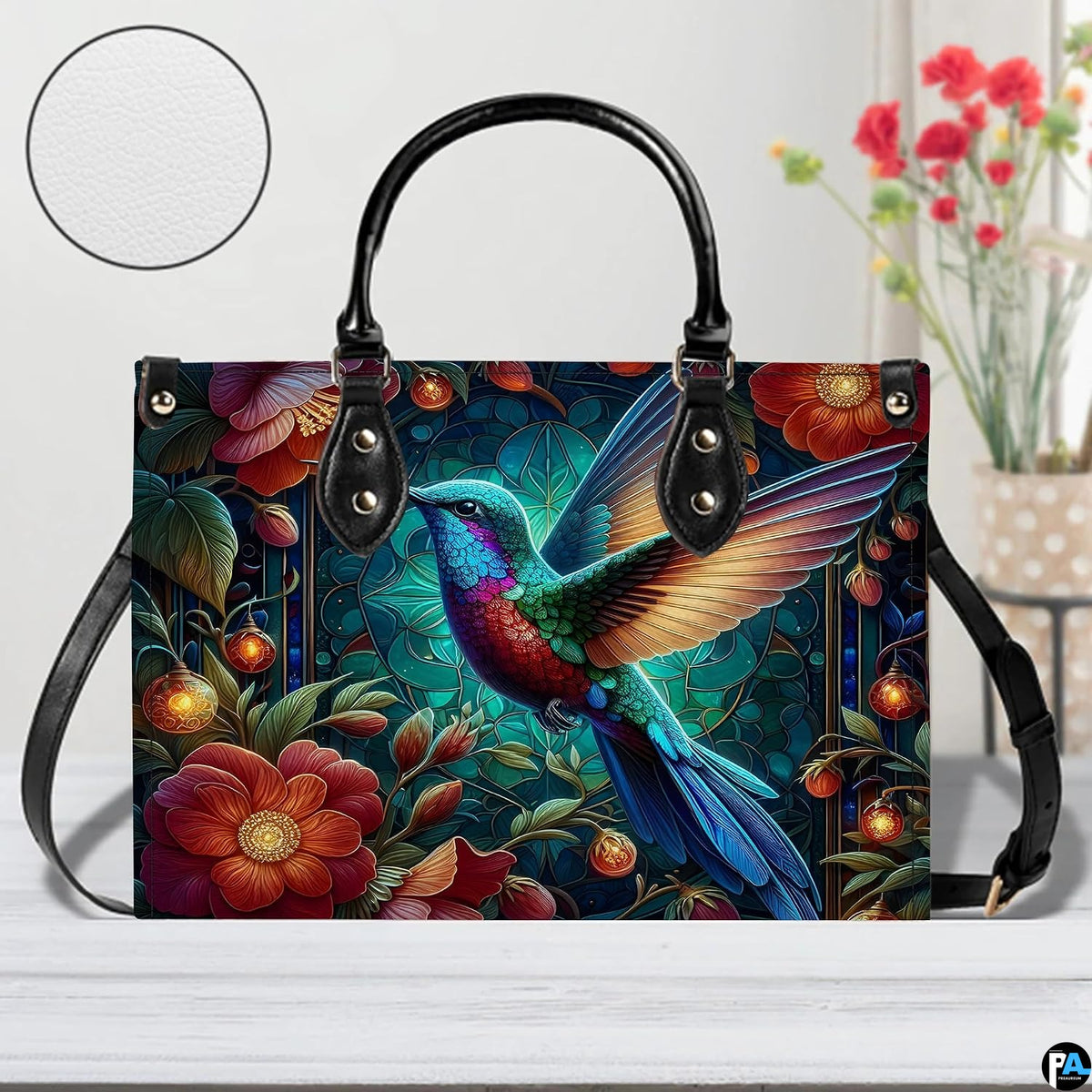 Side profile view of twilight hummingbird handbag displaying structured silhouette and depth.