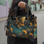 Street fashion view of model carrying celestial dragonfly handbag by the top handle