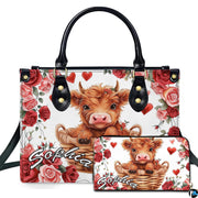 Front studio view showing fluffy Highland calf in a woven wicker basket surrounded by red roses and hearts.