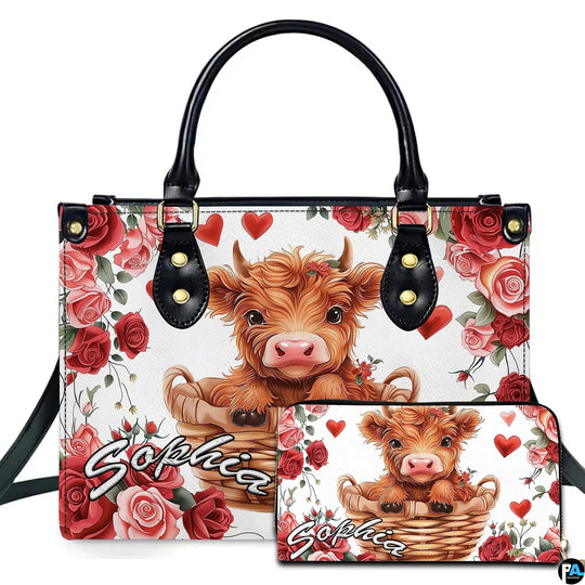 Front studio view showing fluffy Highland calf in a woven wicker basket surrounded by red roses and hearts.
