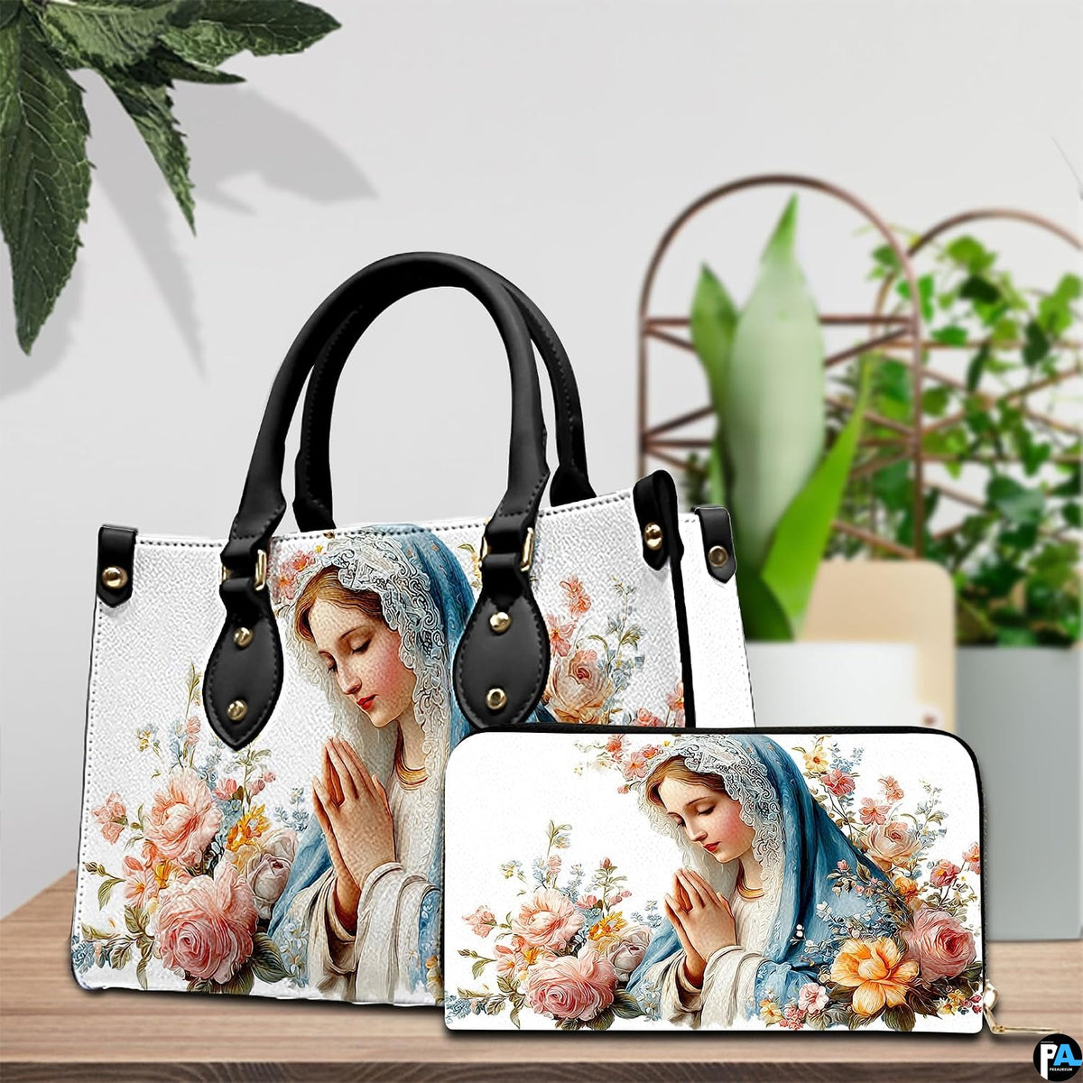 Matching praying Virgin Mary handbag and zip wallet set shown together.