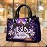 Standing view of the purple cross scripture handbag on a wooden tabletop in front of a warm interior.