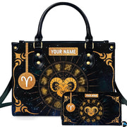 Golden celestial zodiac ram handbag and matching wallet set featuring radiating horoscope wheel.