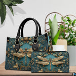 Tabletop lifestyle presentation of gold dragonfly handbag and matching wallet with potted plants