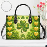 Front view of green clover handbag with gold hearts and starry sparkles