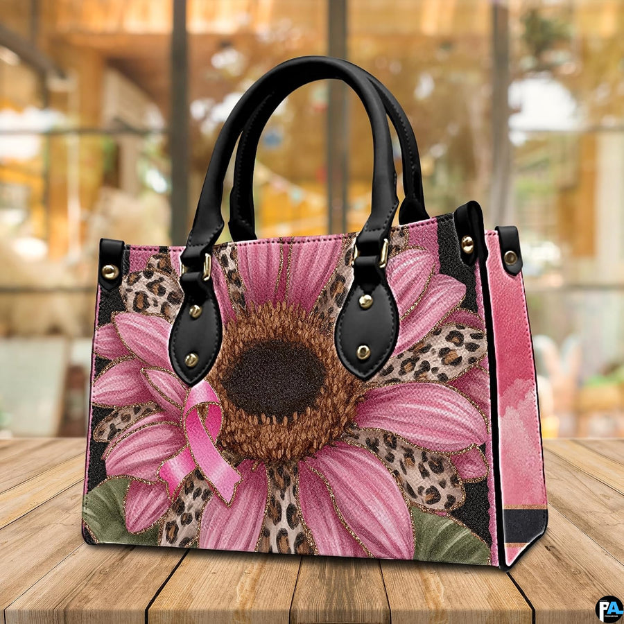 Angled tabletop perspective featuring pink sunflower art accessory showcased in indoor cafe setting.