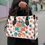 Coordinating pastel paw print tote handbag and zippered wallet duo