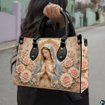 Model holding light blue veil Virgin Mary baroque handbag outdoors