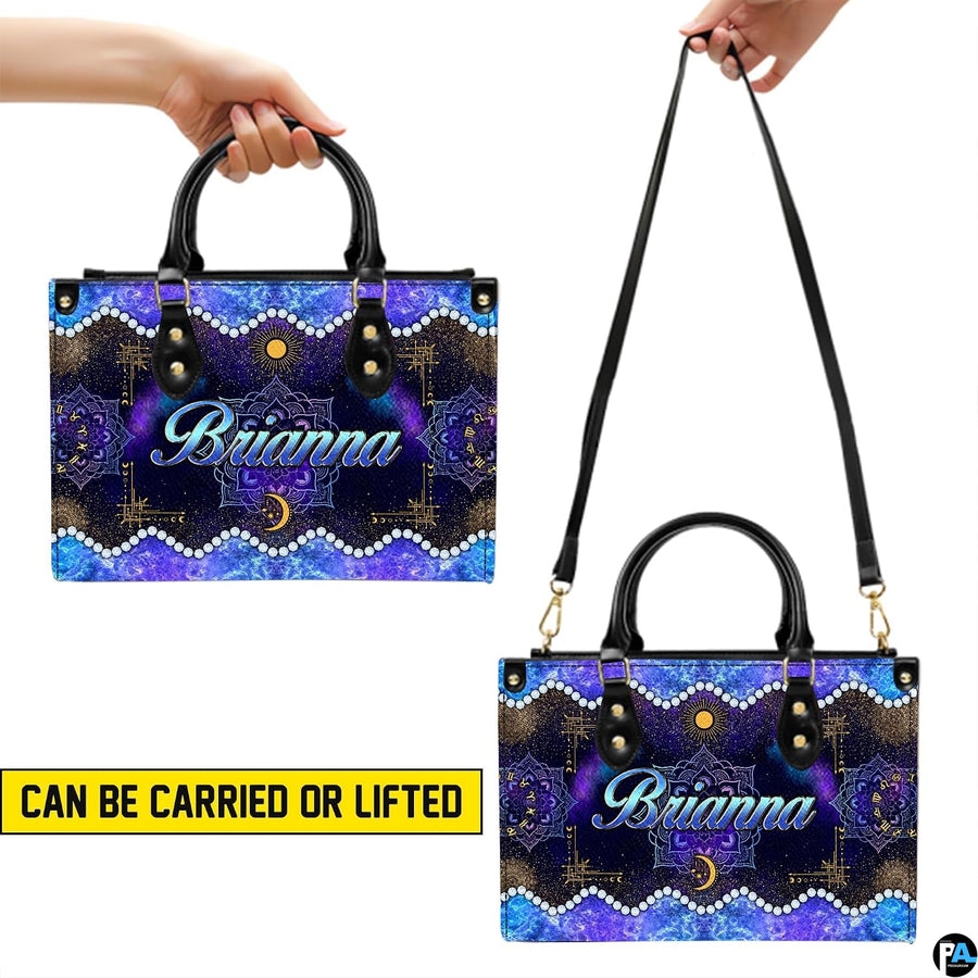Presentation showing hand carry and shoulder strap carry options for Celestial Mandala Satchel Handbag.