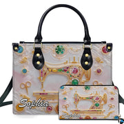 Golden sewing machine artwork presented beside matching companion accessory on neutral surface.