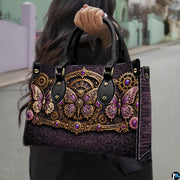 Lifestyle presentation of steampunk butterfly handbag and wallet set with accessories