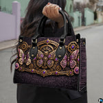 Lifestyle presentation of steampunk butterfly handbag and wallet set with accessories