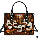 Autumn satchel featuring five cute ghosts reading books in a vintage library filled with pumpkins and books.