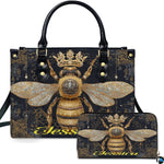 Front view of crowned queen bee handbag and matching wallet set with golden filigree artwork.
