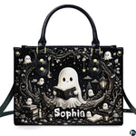 Front product view of structured satchel displaying monochrome reading ghost and bookish spirits artwork.
