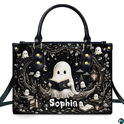 Front product view of structured satchel displaying monochrome reading ghost and bookish spirits artwork.