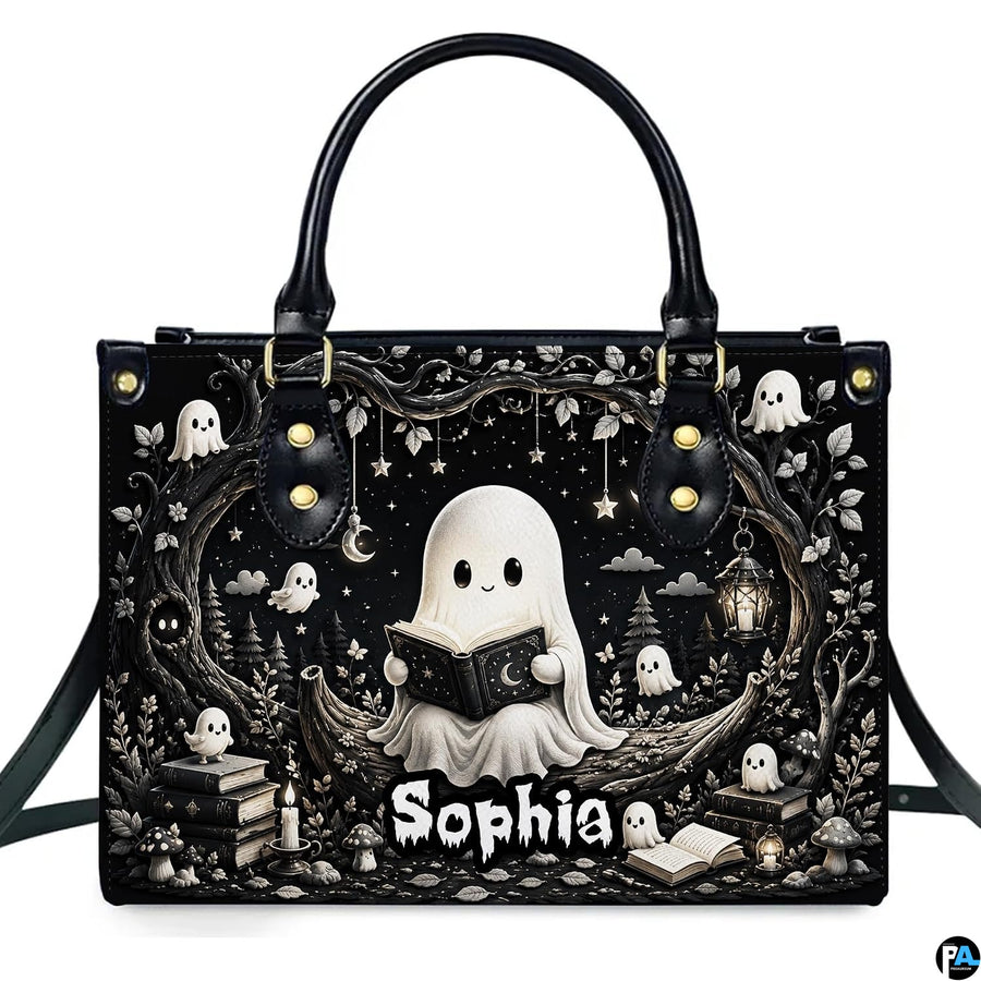 Front product view of structured satchel displaying monochrome reading ghost and bookish spirits artwork.