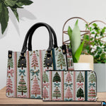 Lifestyle arrangement featuring holiday tree column artwork beside potted indoor botanical foliage.